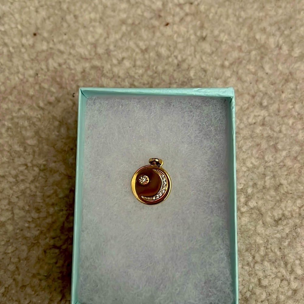 Moon and starts gold plated pendant.